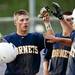 Saline senior center fielder Gage Hammond celebrates scoring a run against Pioneer on Monday, May 20. Saline won 19-2,  8-3. Daniel Brenner I AnnArbor.com 